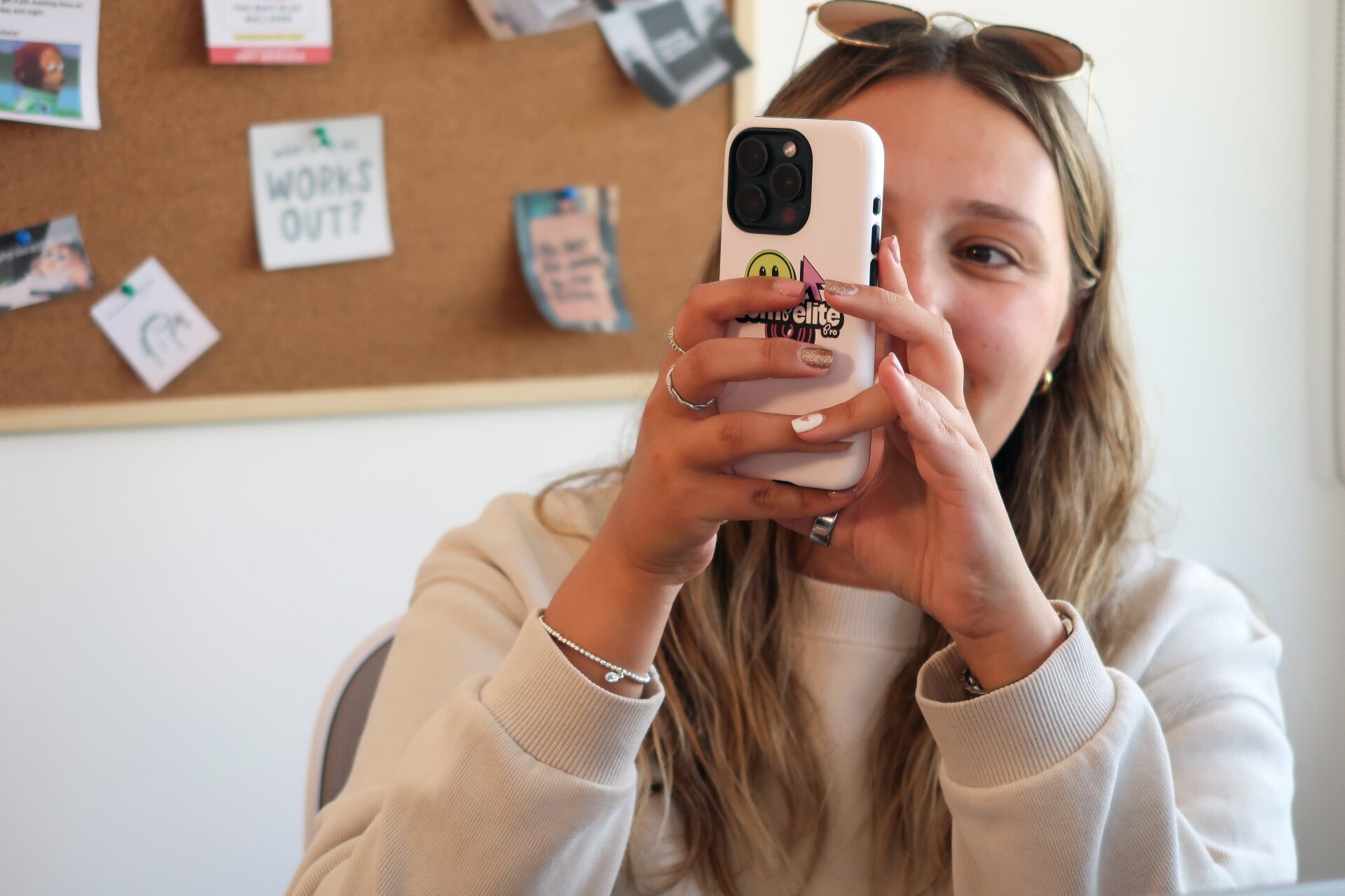 Compelite Pro team member capturing content on a phone in the Bristol office