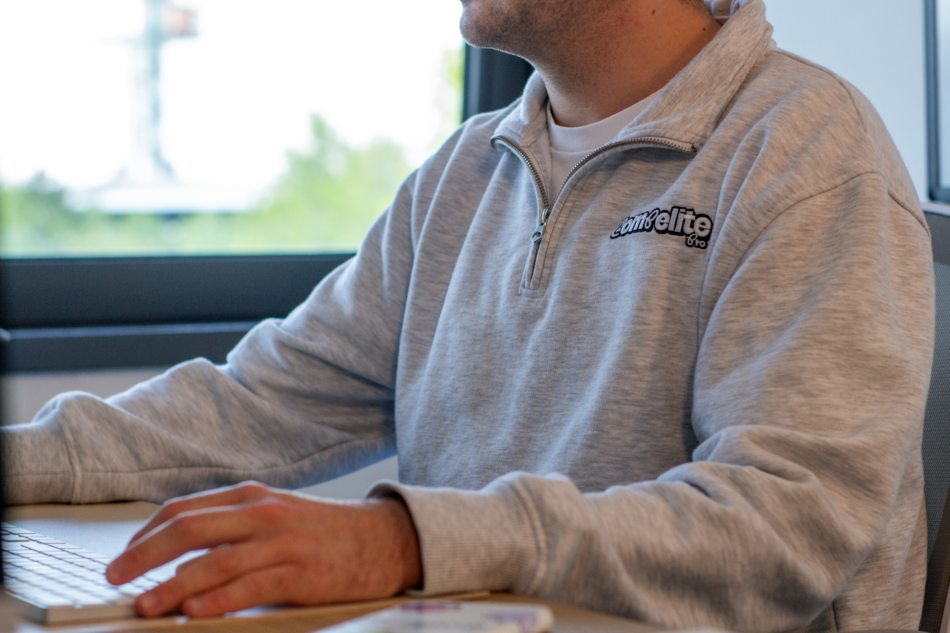 Compelite Pro team member working on a client's social feed in the Bristol office